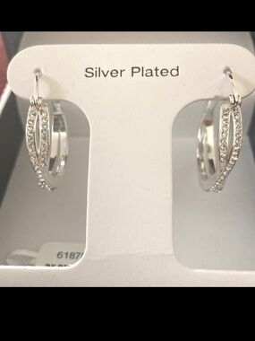 And Now This Crystal Crossover Hoop Earrings. 0.95" diameter. Silver plated. NWT